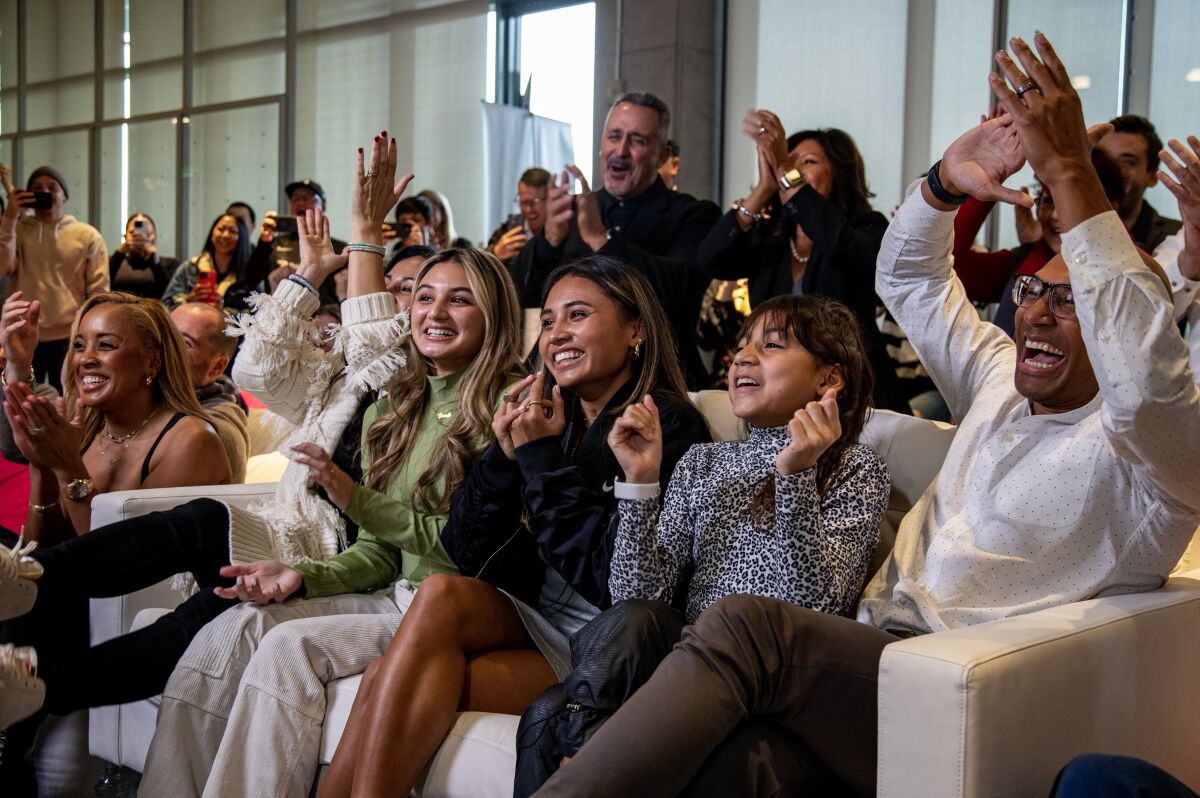 Alyssa Thompson, center, celebrates among family and fans at Nike L.A. after being selected No. 1 by Angel City FC.