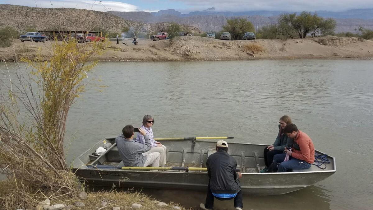 Ferryman Carmelo Sandoval gets ready for the trip across the Rio Grande toward Boquillas del Carmen after tourists Melisa and Hal Epperson, left, of Kissimmee, Fla., board with another couple.