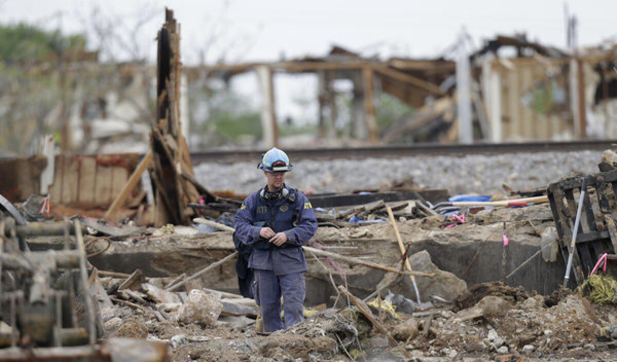 An investigator looks over a destroyed fertilizer plant in West, Texas.