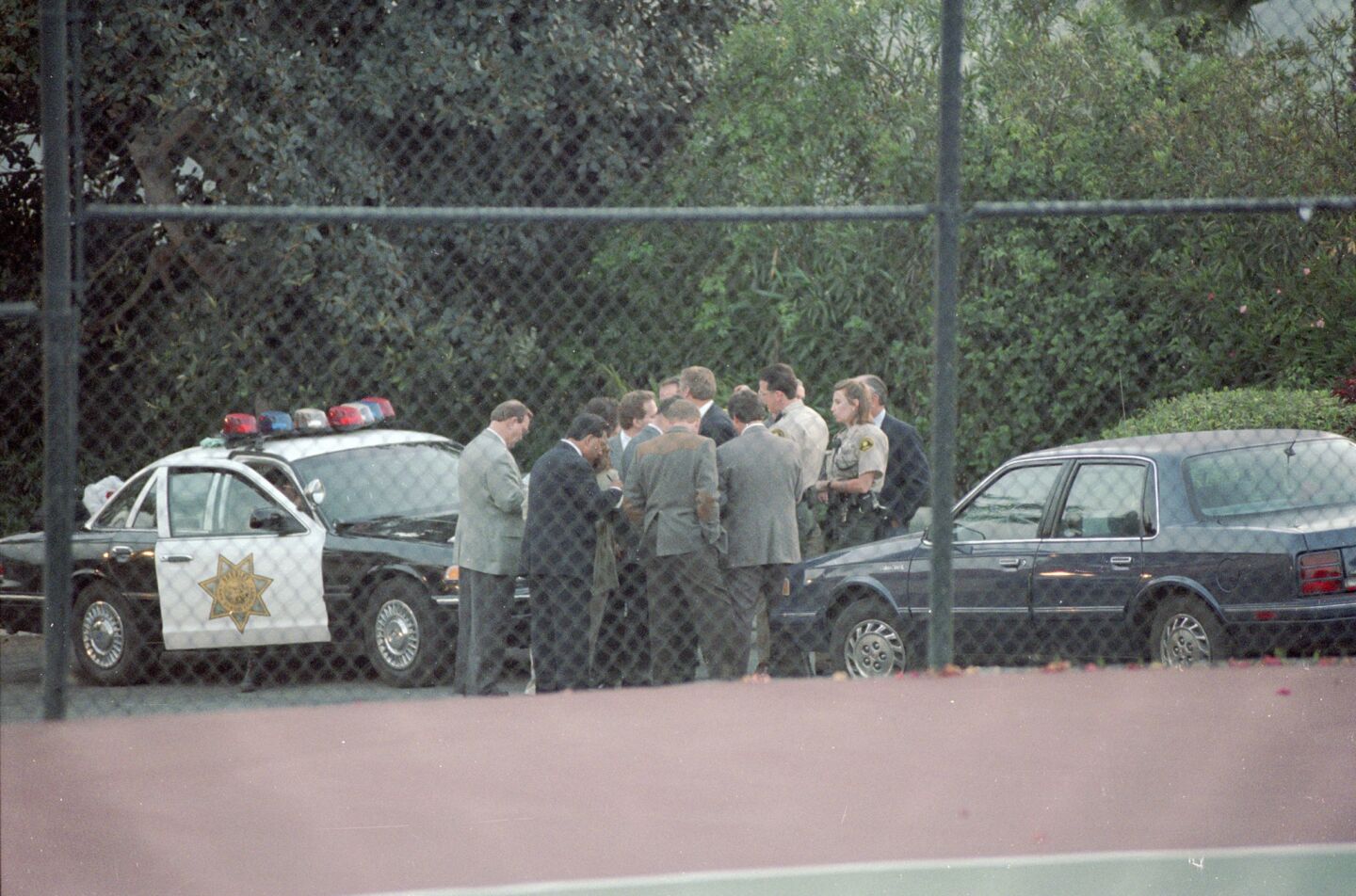 Sheriff's investigators waited outside a Rancho Santa Fe mansion for hours until a search warrant was issued to enter the home where the bodies of 39 Heaven's Gate members were found on March 26, 1997.