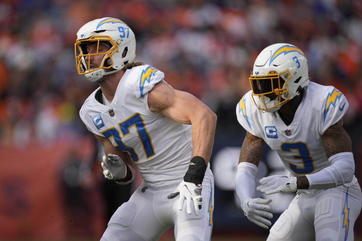  Chargers defenders Joey Bosa (97) and Derwin James Jr. (3) pursue against Denver.