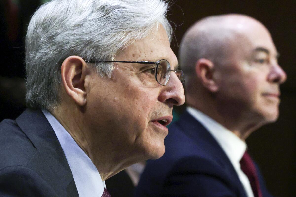 Attorney General Merrick Garland, left, and Homeland Security Secretary Alejandro Mayorkas, testify before the Senate Appropriations committee hearing to examine domestic extremism, Wednesday, May 12, 2021 on Capitol Hill in Washington. (Alex Wong/Pool via AP)