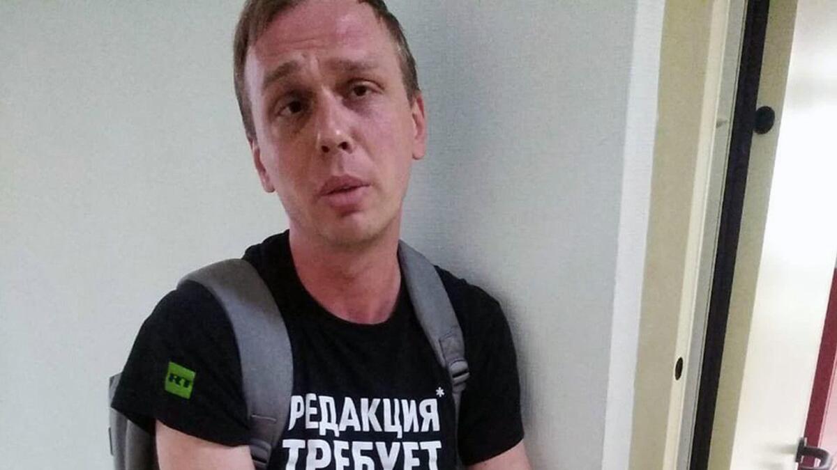 In this handout photo taken on June 6 and released by the website Meduza, Ivan Golunov stands at a police station in Moscow.