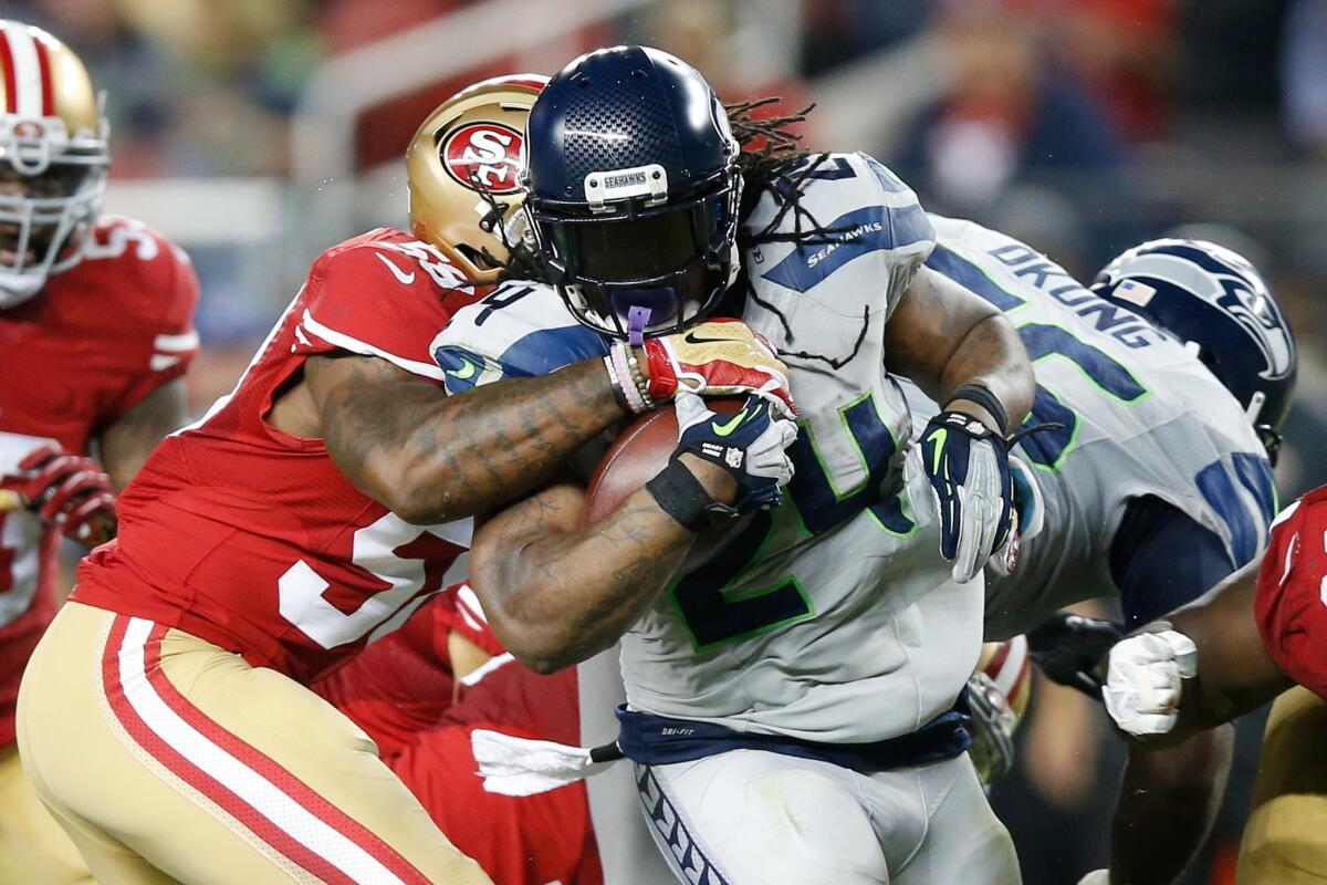 Seahawks running back Marshawn Lynch picks up yards against the 49ers during a game Oct. 22.