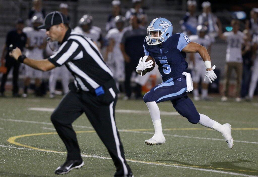 Corona del Mar's Cameron Kormos sprints for the end zone for a first half touchdown against Trabuco Hills.