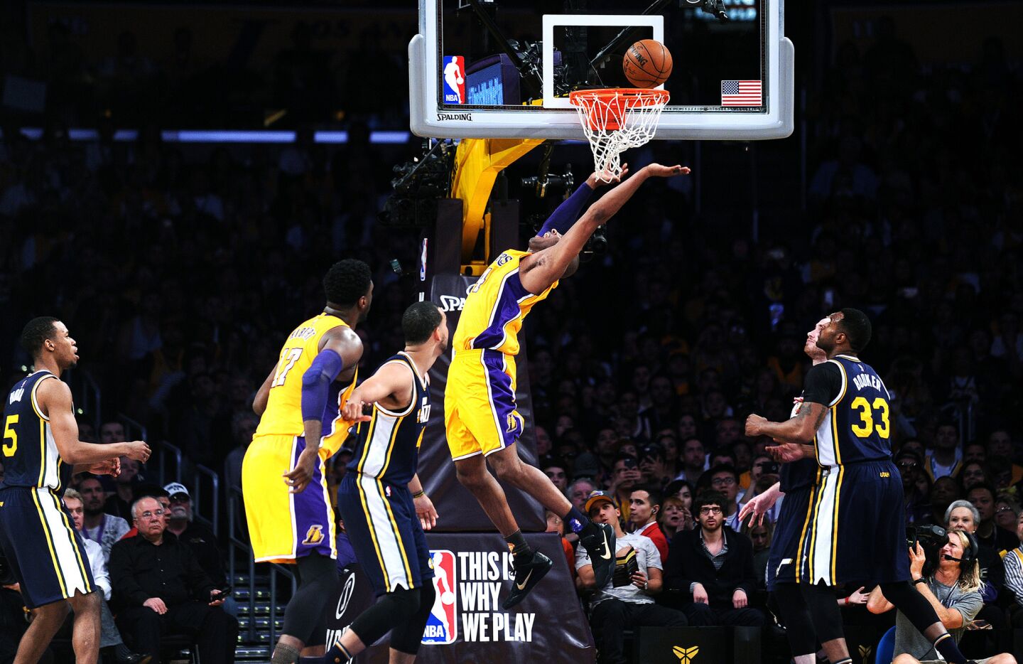 Kobe Bryant stretches out as he makes a basket during his final game as a Laker on April 12 at Staples Center.