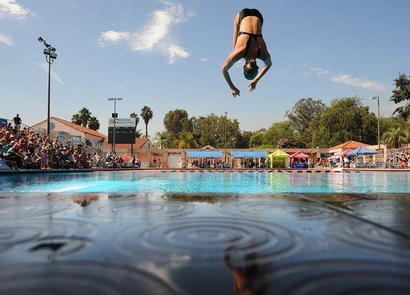 A diver flips through the air in the synchronized competition at the 2008 Kaiser Permanente National Diving Championships in Pasadena.