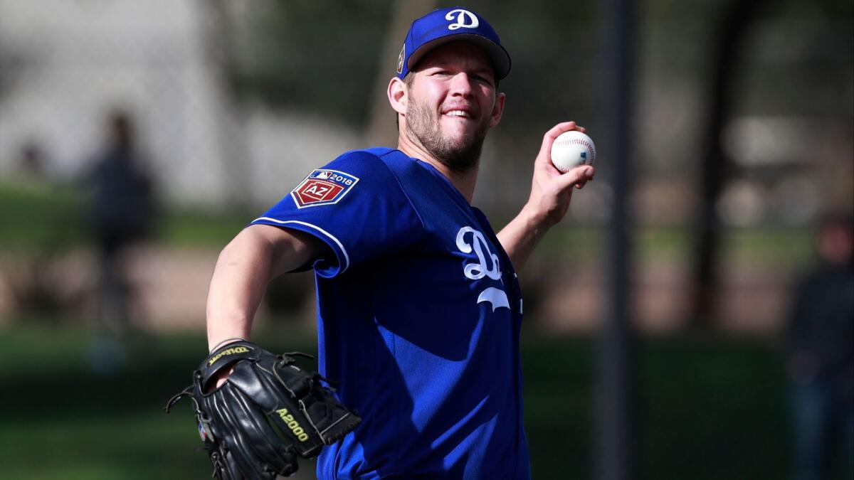 Dodgers pitcher Clayton Kershaw throws during the team's first official workout of spring training on Feb. 19.