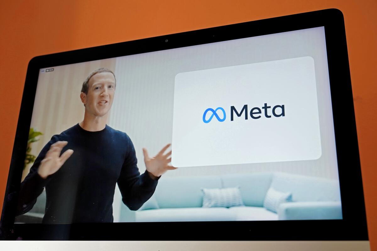Mark Zuckerberg on a screen announcing Facebook's new name, Meta.