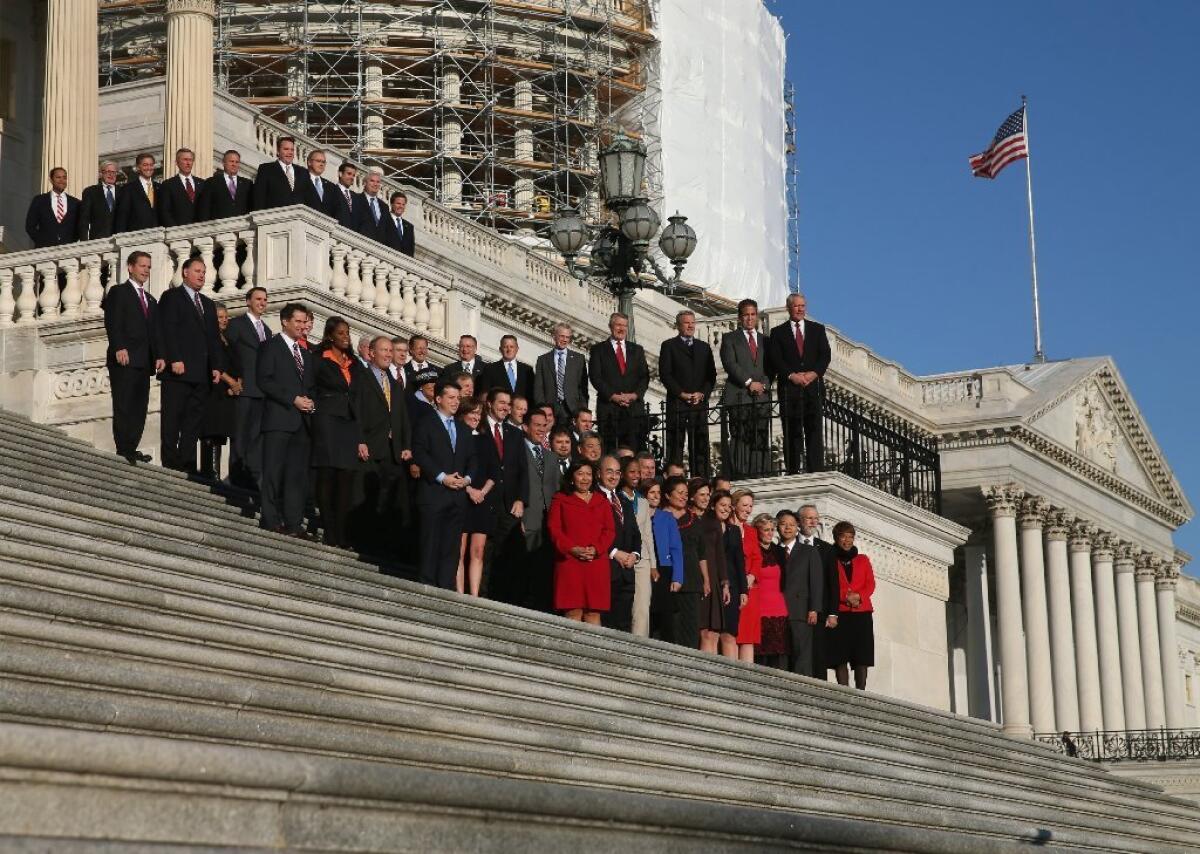 Newly elected members of the upcoming 114th Congress pose for a class photo on the steps of the U.S. Capitol on Nov. 18 in Washington.