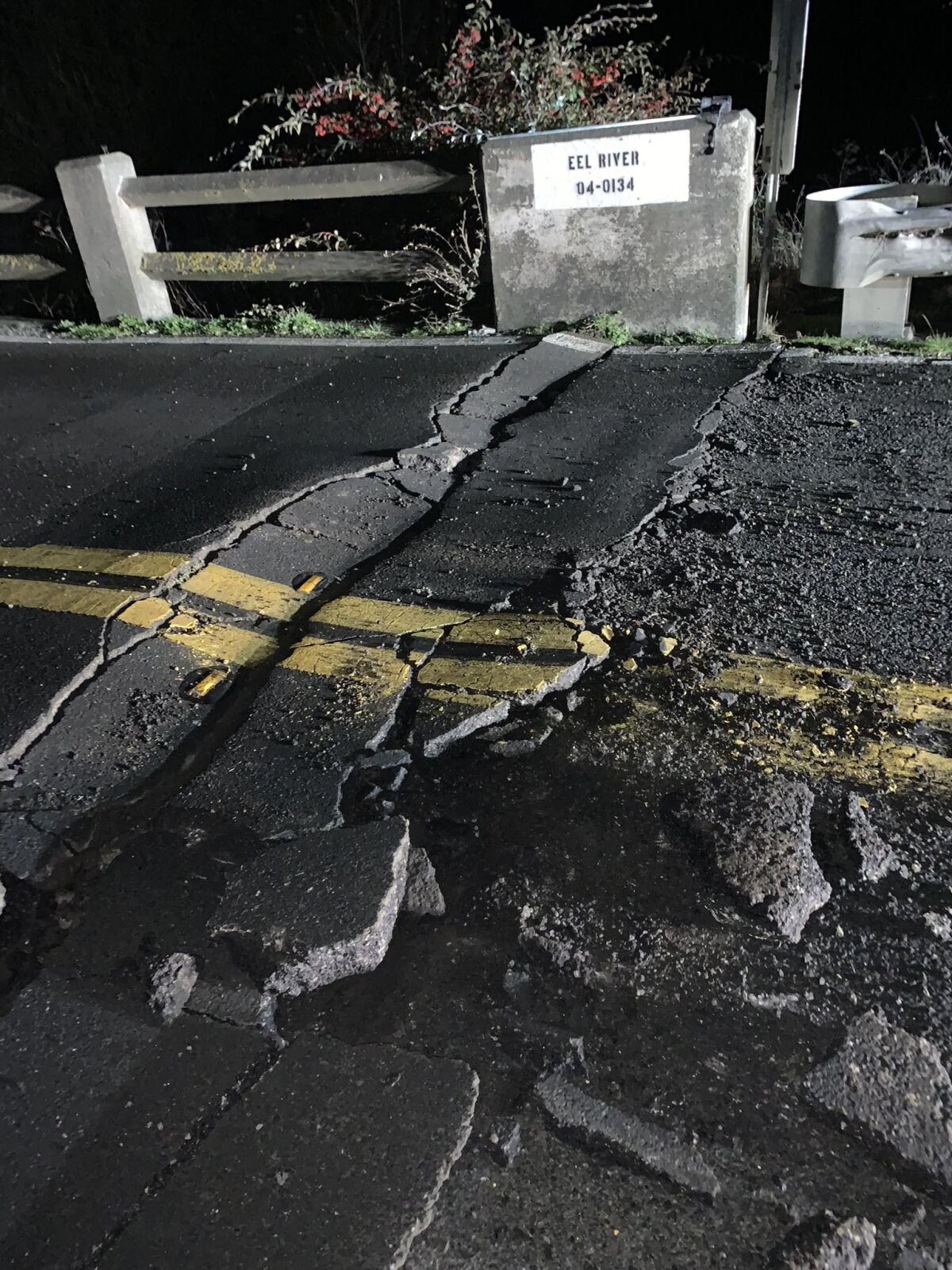 Cracks run across a road.