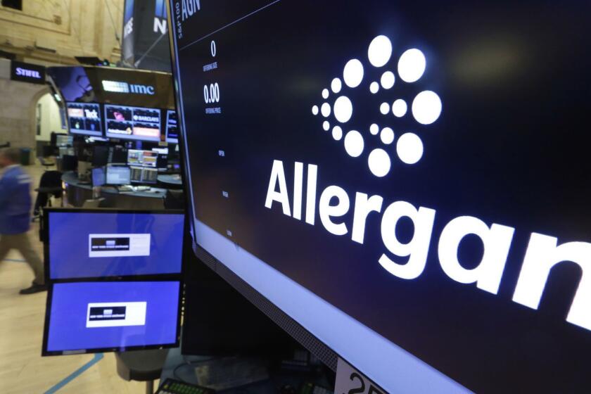 FILE - In this Nov. 23, 2015, file photo, the Allergan logo appears above a trading post on the floor of the New York Stock Exchange. Allergan reports financial results on Tuesday, May 7, 2019. (AP Photo/Richard Drew, File)