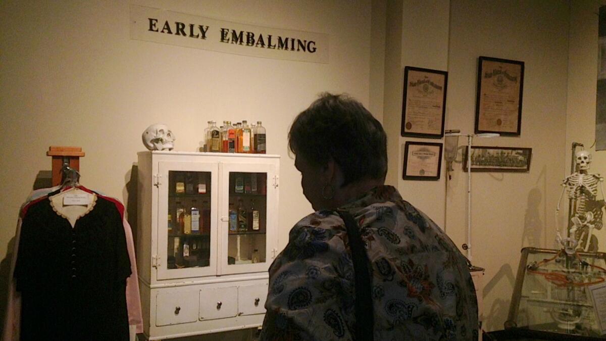Linda Parker, 70, browses the embalming exhibit at the National Museum of Funeral History in Houston. The museum was started in 1992 by the founder of the country's largest funeral home chain.