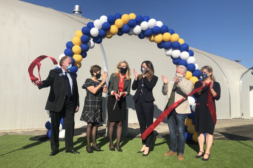 Huntington Beach City Council members participate in Monday's ribbon cutting ceremony for the new Navigation Center. Pictured, left to right, are Mike Posey, Barbara Delgleize, Mayor Lyn Semeta, Mayor Pro Tem Kim Carr, Patrick Brenden and Jill Hardy.