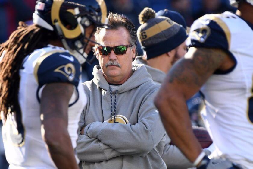 Rams Coach Jeff Fisher watches his players warm up before a game with the New England Patriots at Gillette Stadium in Foxborough, Mass. on Dec. 4.