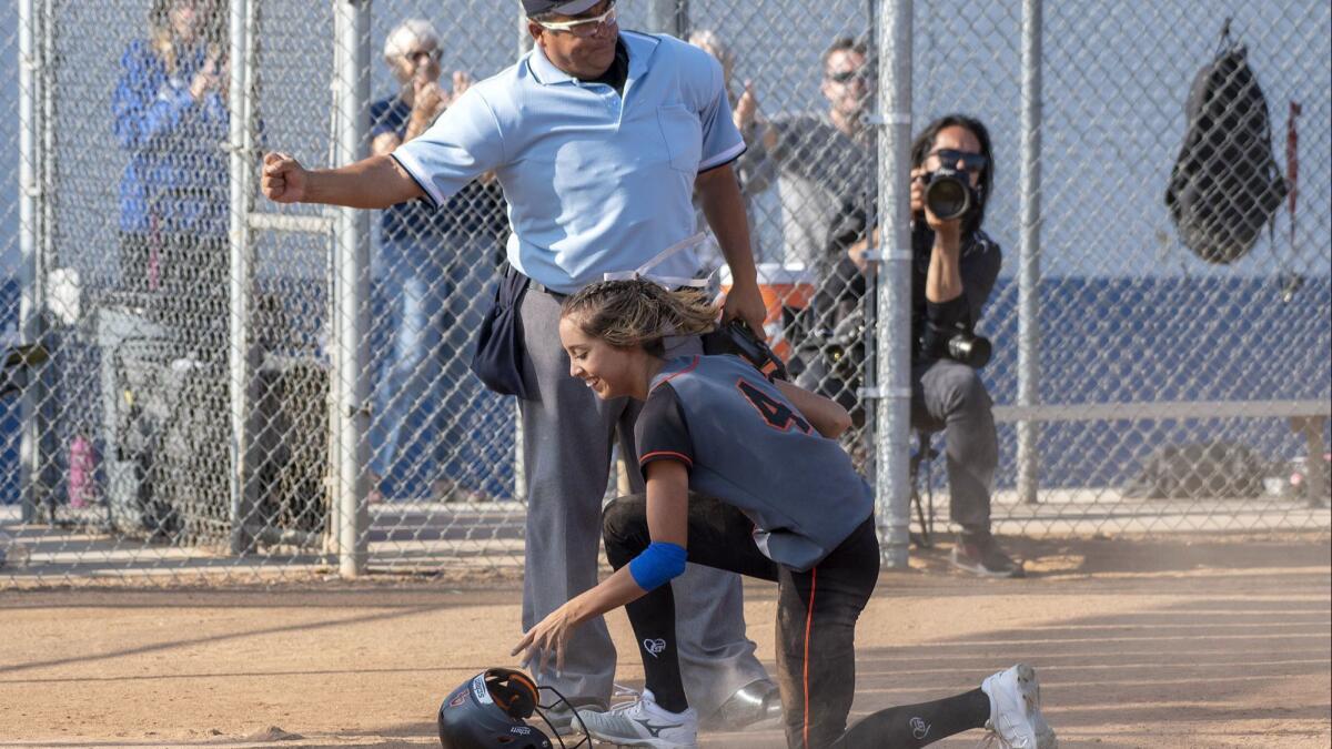 Huntington Beach's Shelbi Ortiz is given the run on an obstruction call at the plate in a quarterfinal CIF Southern Section Division 1 playoff game on Thursday, May 24. Ortiz was initially given the run due to an obstruction call but the call was overturned.