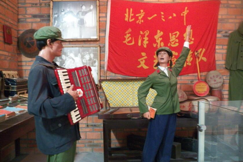A life-size diorama shows people performing "revolutionary songs" during the Cultural Revolution of 1966-76 at the Jianchuan Museum Cluster in Anren, China. The country's media regulator has announced a new program that echoes the period.