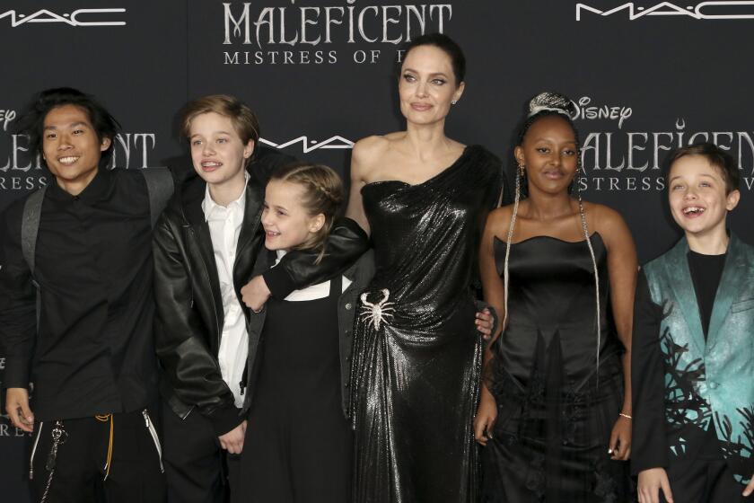 Angelina Jolie, third right, and her children, from left, Maddox Jolie-Pitt, Shiloh Jolie-Pitt, Vivienne Jolie-Pitt, Zahara Jolie-Pitt and Knox Jolie-Pitt arrive at the world premiere of "Maleficent: Mistress of Evil" on Monday, Sept. 30, 2019, at the El Capitan Theatre in Los Angeles. (Photo by Willy Sanjuan/Invision/AP)