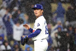 LOS ANGELES, CALIFORNIA - MARCH 30: Dodgers pitcher Yoshinobu Yamamoto against the Cardinals.