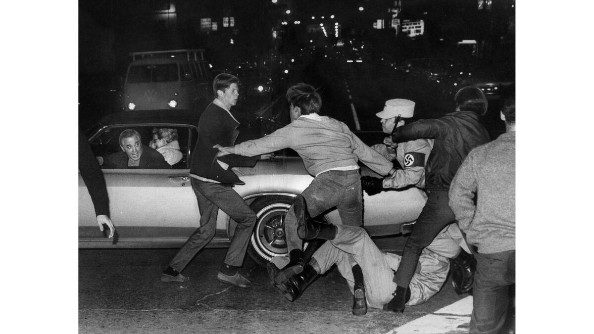 Fighting breaks out between Nazi demonstrators and counter-protesters outside of a Westwood movie theater on Dec. 22, 1967.