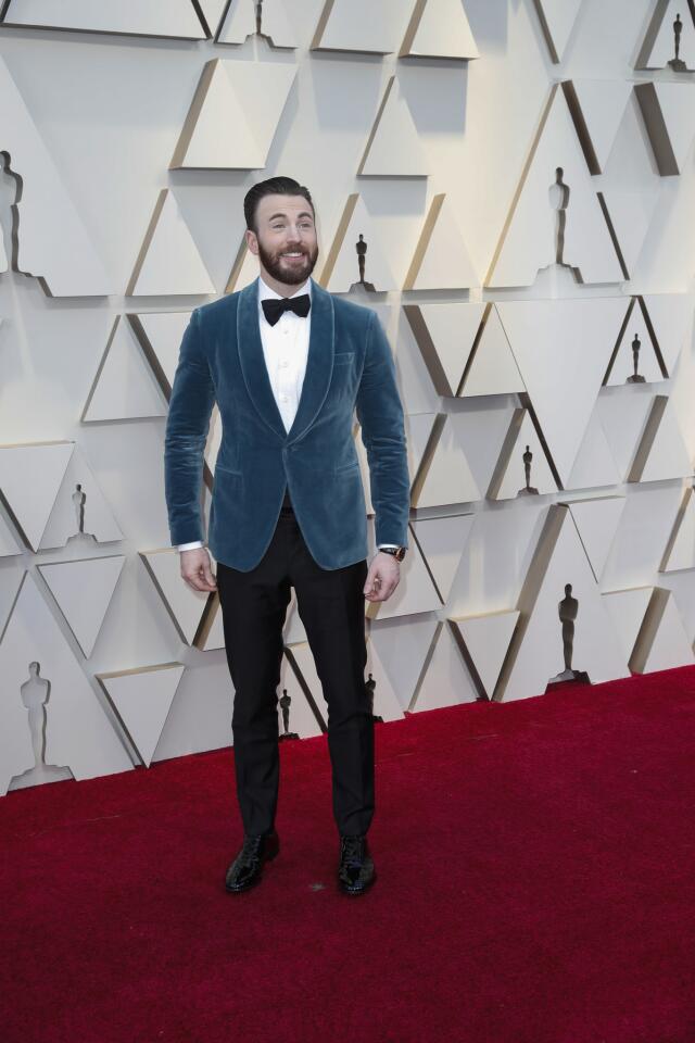 HIT: Chris Evans is a standout in this teal tuxedo jacket by Salvatore Ferragamo.
