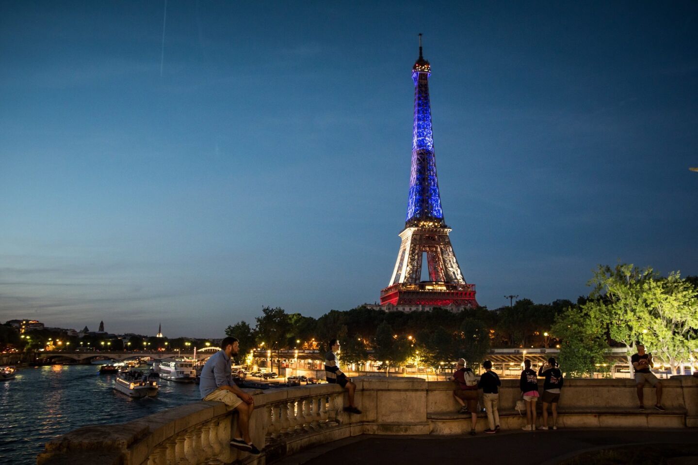 The Eiffel Tower in Paris is illuminated in the colors of the French flag in solidarity with the victims of the terror attack in Nice.