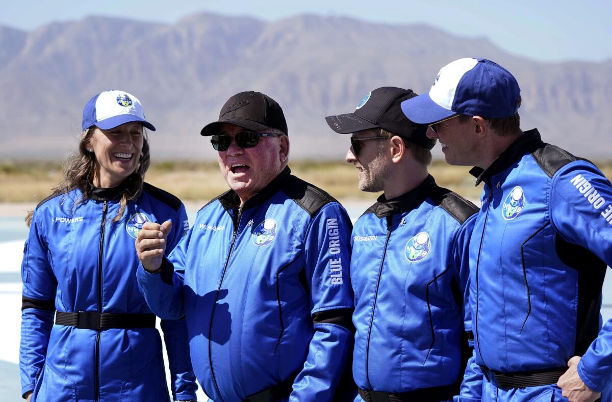 Audrey Powers, left, William Shatner, Chris Boshuizen and Glen de Vries after their spaceflight.