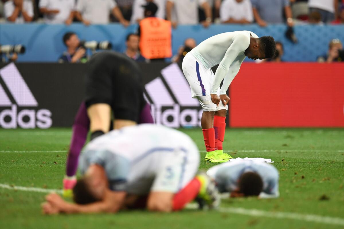 England forward Daniel Sturridge (back) and his teammates react after losing 2-1 to Iceland in the Euro 2016 round of 16 match.