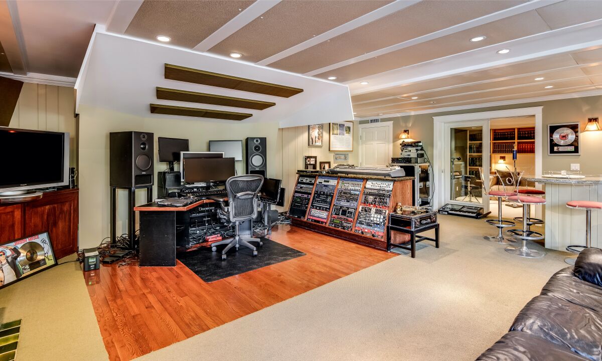 The two-story home of roughly 5,400 square feet features a lower level with a recording studio and wet bar.
