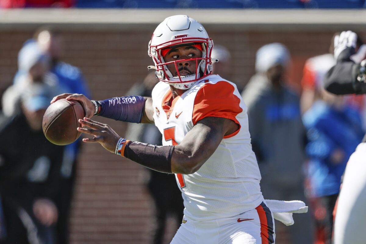 American Team quarterback Malik Willis, of Liberty, throws a pass during the first half of the NCAA Senior Bowl college football game, Saturday, Feb. 5, 2022, in Mobile, Ala. (AP Photo/Butch Dill)