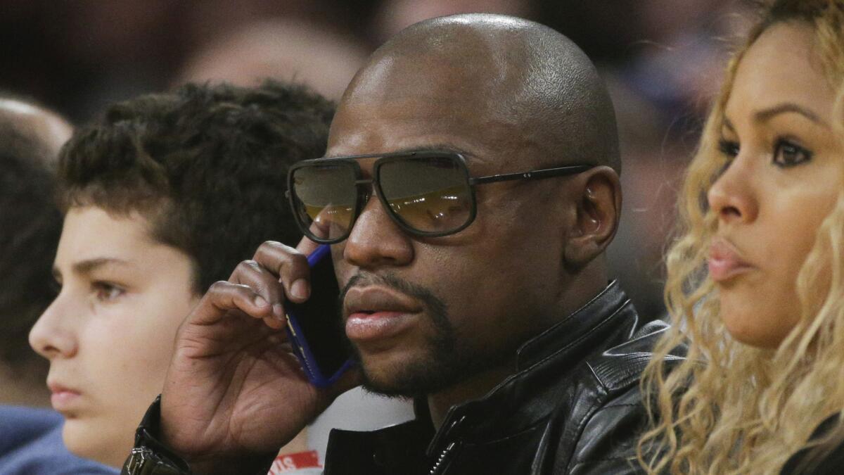 Boxer Floyd Mayweather attends a game between the L.A. Lakers and the Sacramento Kings at Staples Center on Dec. 9.