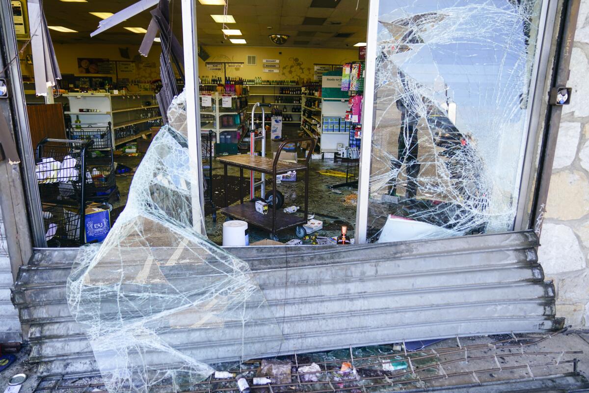 Glass in a storefront is smashed.