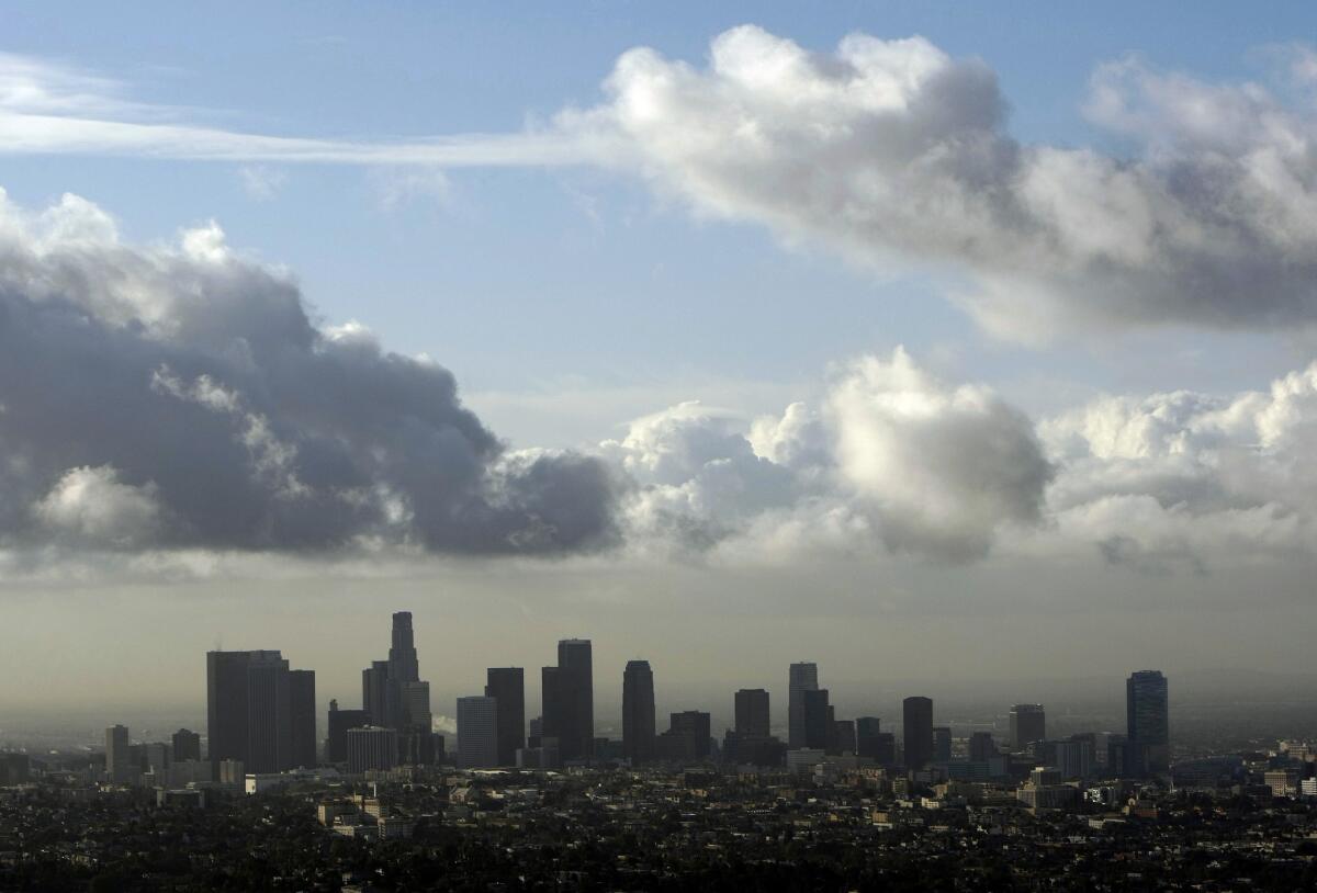 A storm system was expected to bring a chance of rain to downtown Los Angeles and up to a quarter inch of rain in mountain areas beginning late Monday, the Weather Service said.