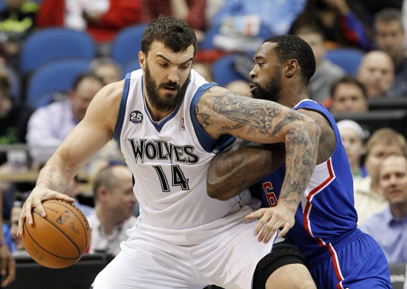 Minnesota Timberwolves center Nikola Pekovic, left, is guarded by Clippers center DeAndre Jordan during the Clippers' 114-104 road win Monday.