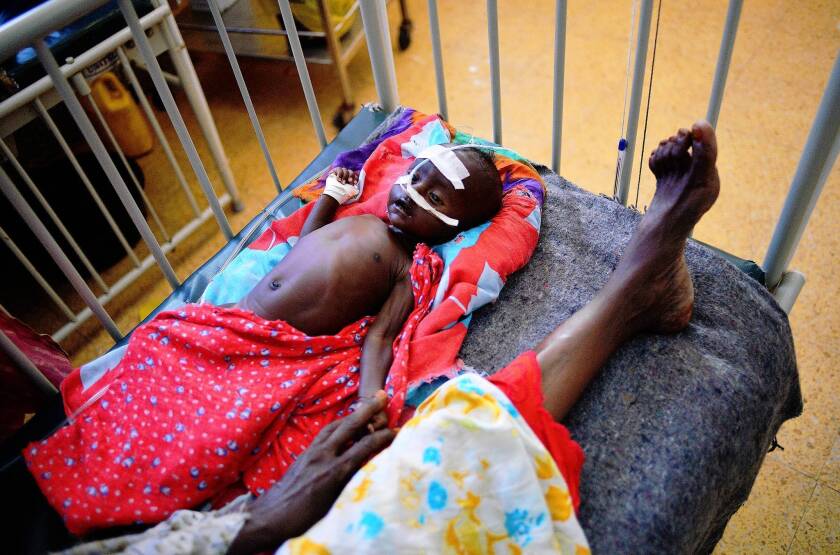 A malnourished child is hospitalized in Mogadishu, Somalia's capital. Nearly 260,000 Somalis perished during the nation's 2010-12 food crisis, a report says.