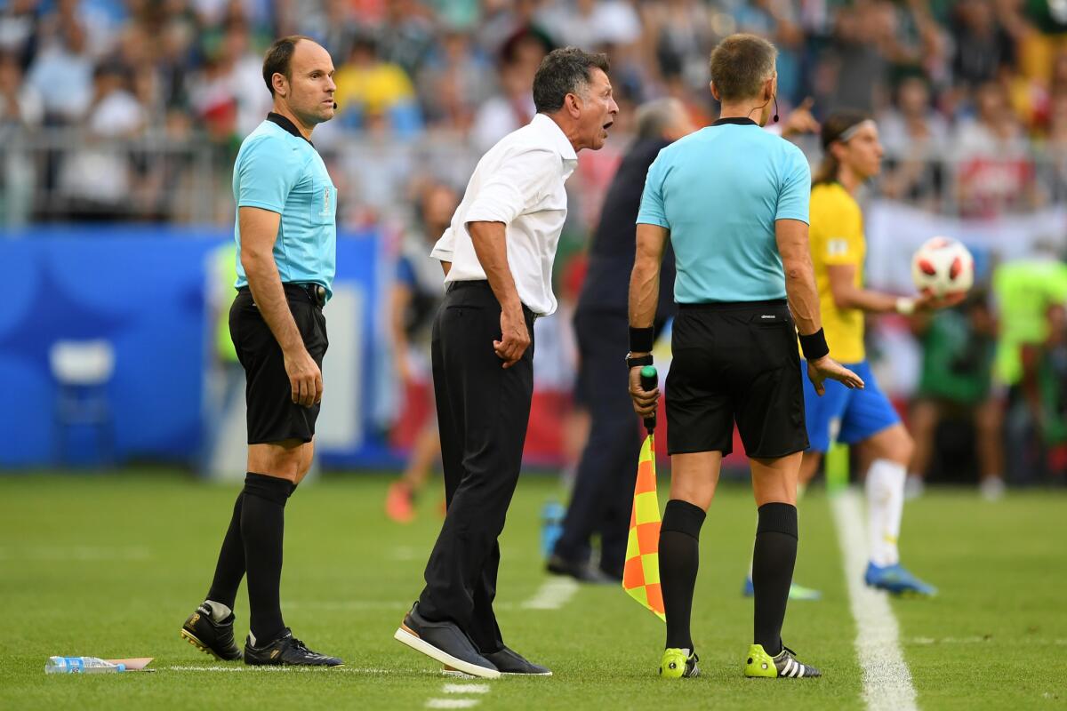 Juan Carlos Osorio, Manager of Mexico complains to fourth official during the 2018 FIFA World Cup Russia Round of 16 match between Brazil and Mexico at Samara Arena on July 2, 2018 in Samara, Russia.