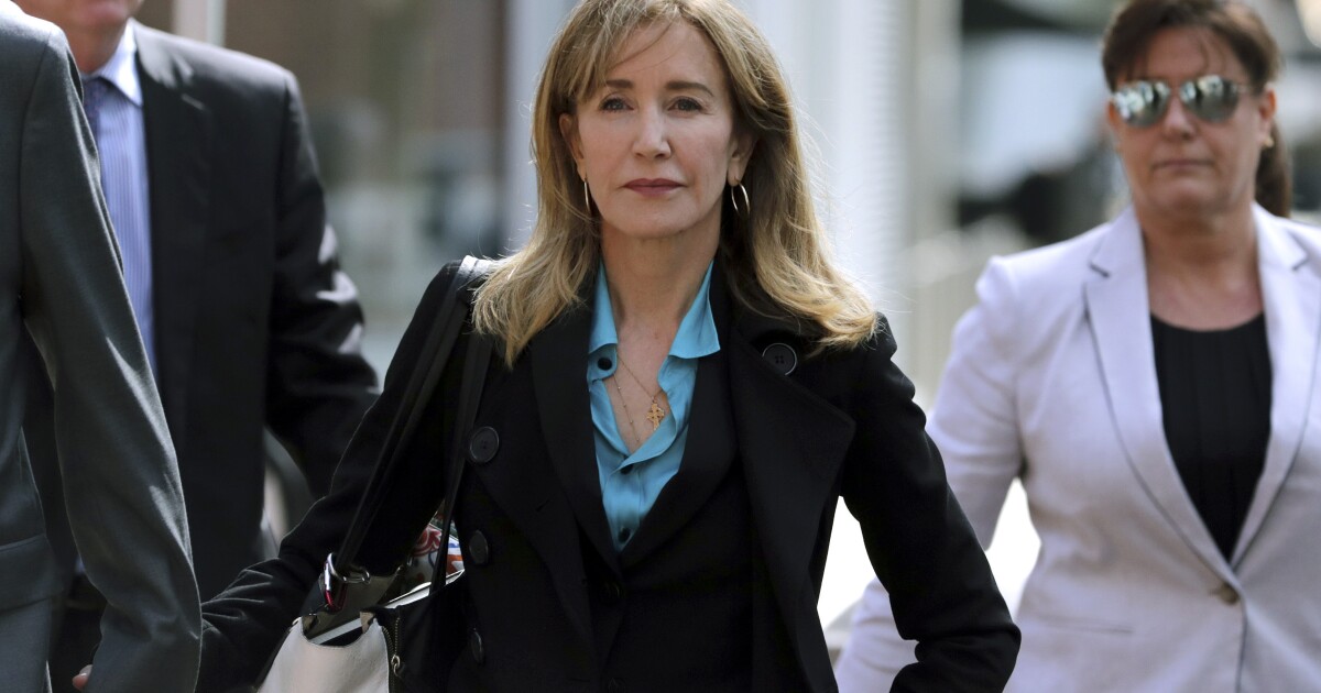 Felicity Huffman&rsquo;s prison outfit is revealed as her family visits