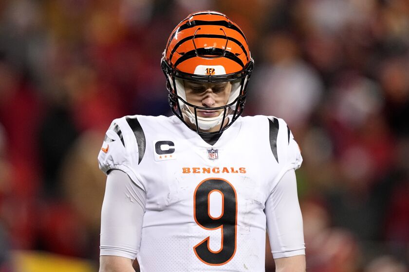 Cincinnati Bengals quarterback Joe Burrow (9) walks back to the sidelines during the second half of the NFL AFC Championship playoff football game against the Kansas City Chiefs, Sunday, Jan. 29, 2023, in Kansas City, Mo. (AP Photo/Brynn Anderson)