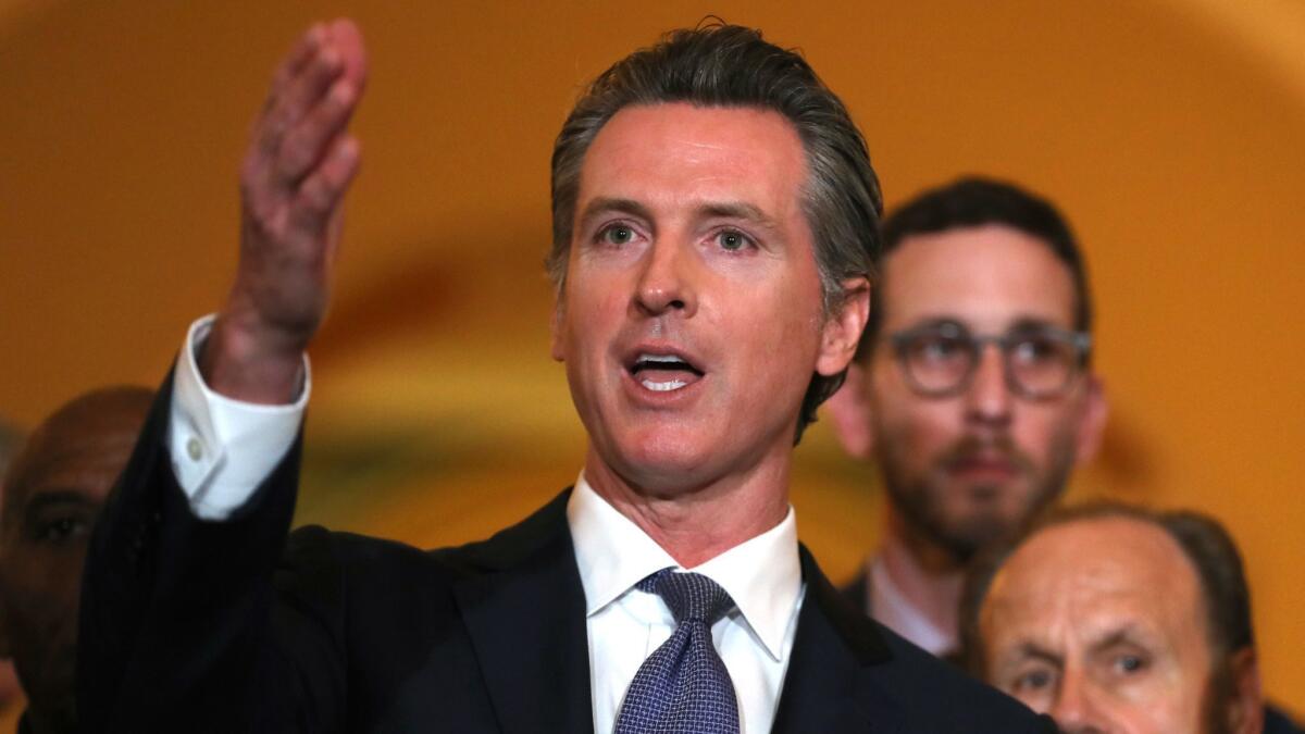 Gov. Gavin Newsom announces a moratorium on California's death penalty during a news conference at the state Capitol on March 13.