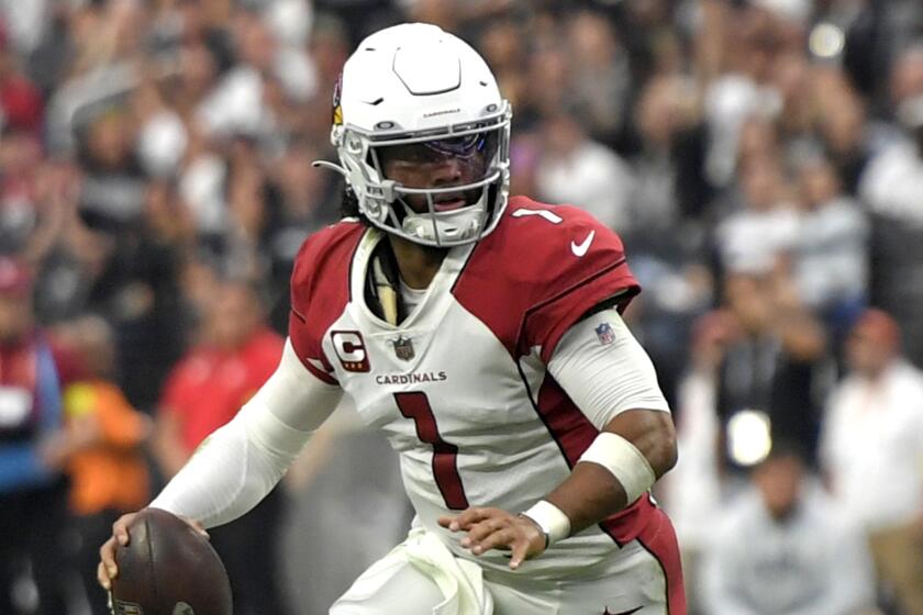 Arizona Cardinals quarterback Kyler Murray (1) scrambles with the ball against the Las Vegas Raiders.