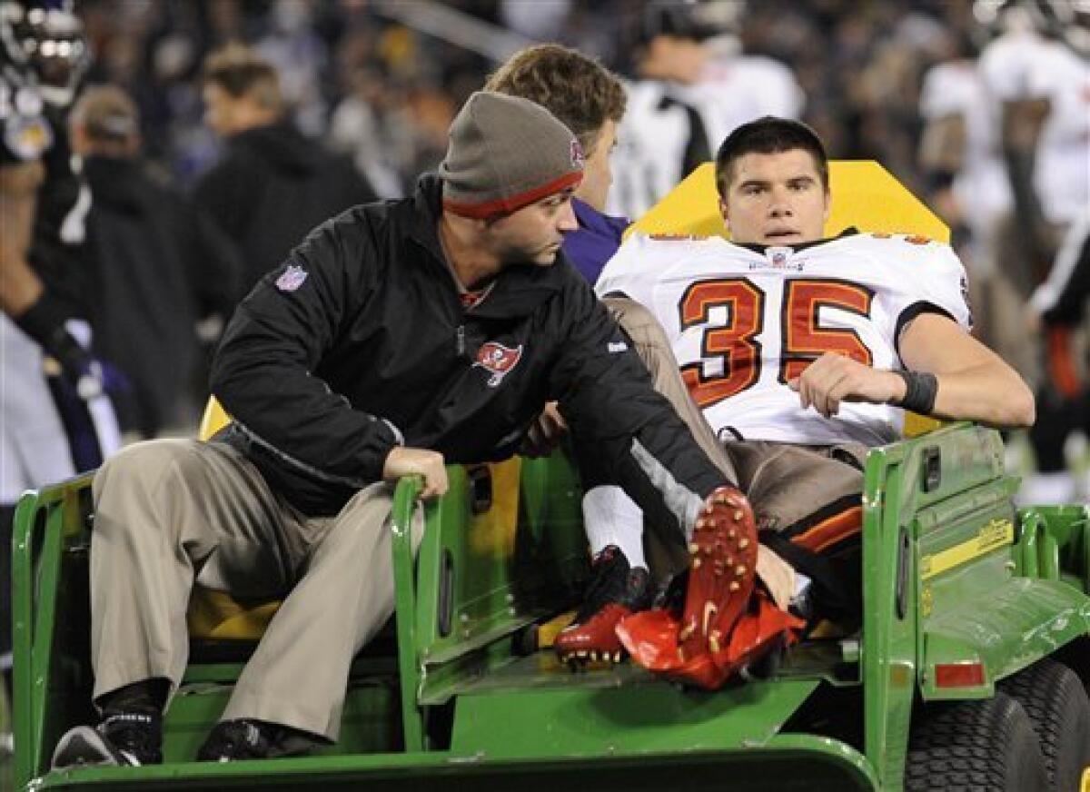 Tampa Bay Buccaneers safety Cody Grimm (35) is driven off the field after being injured during the first half of an NFL football game against the Baltimore Ravens, Sunday, Nov. 28, 2010, in Baltimore. (AP Photo/Nick Wass)