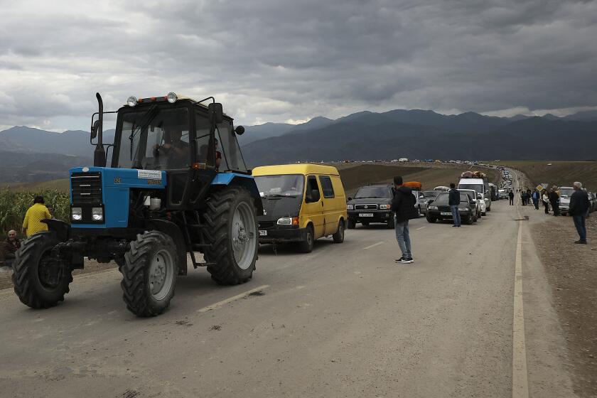 A convoy of cars of ethnic Armenians from Nagorno-Karabakh move to Kornidzor in Syunik region, Armenia, Tuesday, Sept. 26, 2023. Thousands of Armenians have streamed out of Nagorno-Karabakh after the Azerbaijani military reclaimed full control of the breakaway region last week. (AP Photo/Vasily Krestyaninov)