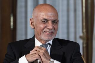 FILE - Afghan President Ashraf Ghani is seated after his meeting with U.S. President Joe Biden in Washington, June 25, 2021. In an interview aired by the BBC on Thursday, Dec. 30, 2021, Afghanistan's former president recounts his final hours in office, says he had just minutes to decide to flee and denies an agreement was in the works for a peaceful takeover, disputing accounts of former government officials, Taliban and even a former U.S. negotiator. (AP Photo/Alex Brandon, File)