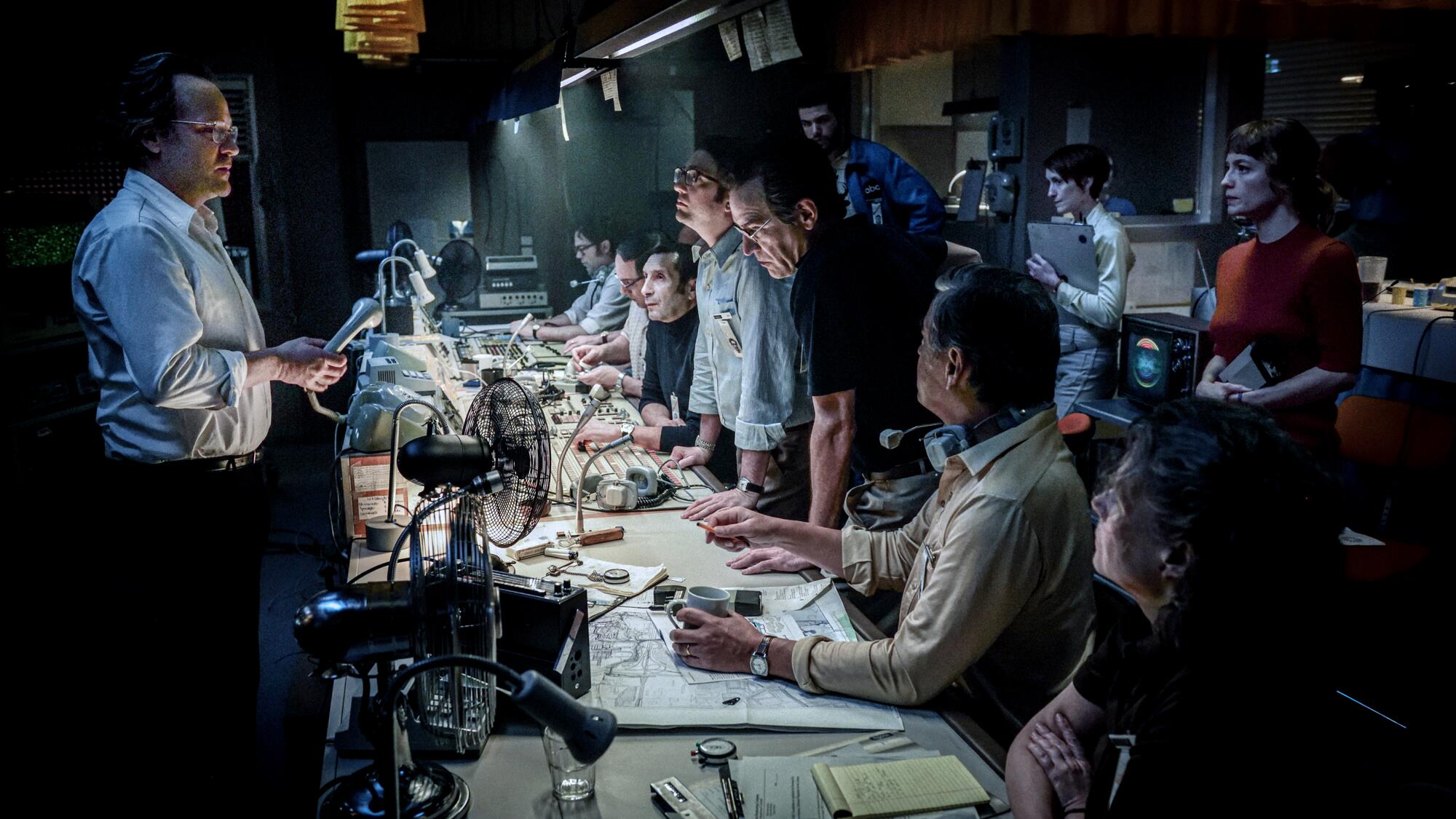 The news team gathers at their desks in "September 5."