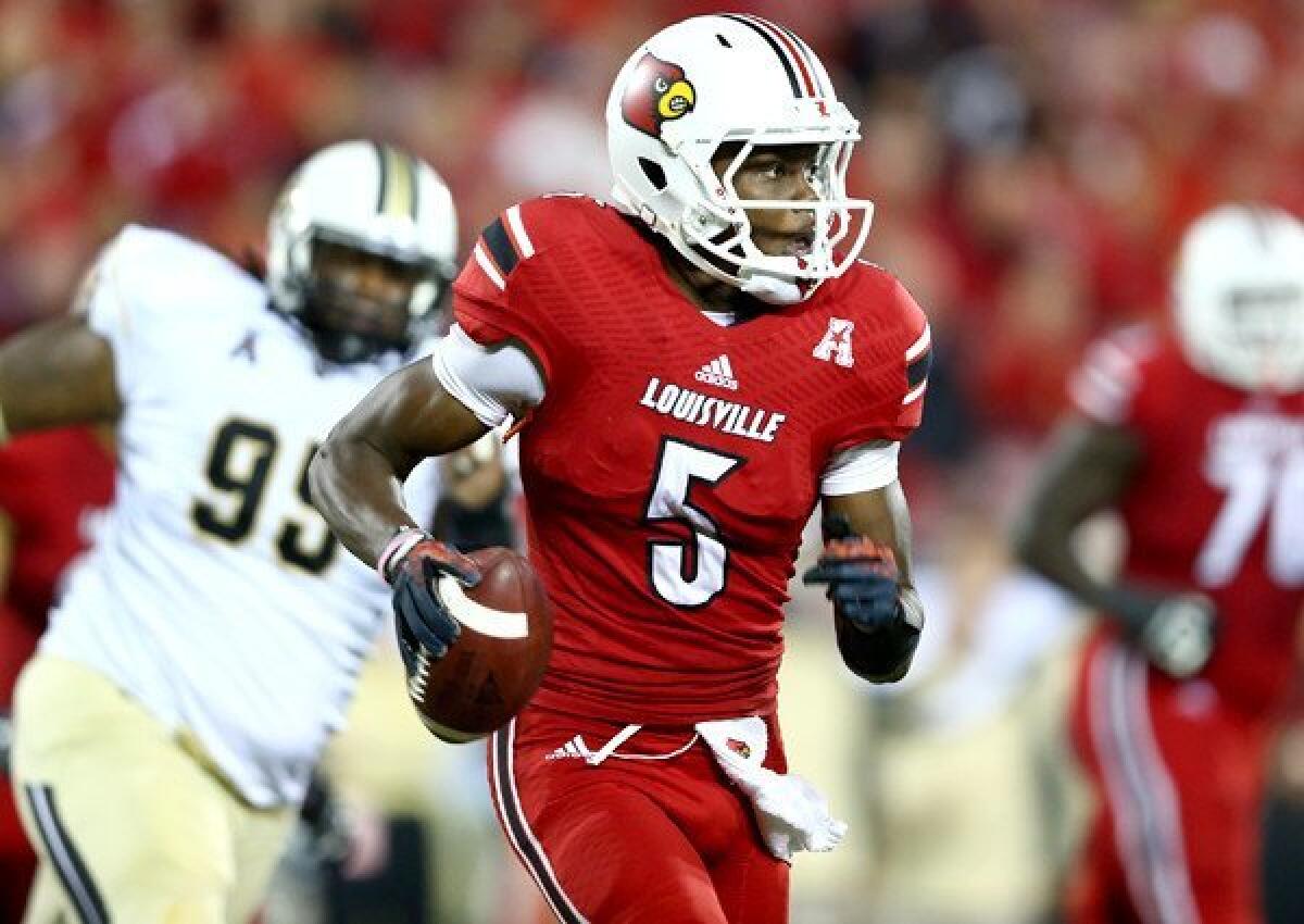 Louisville quarterback Teddy Bridgewater scrambles from Central Florida pressure during a game earlier this season.
