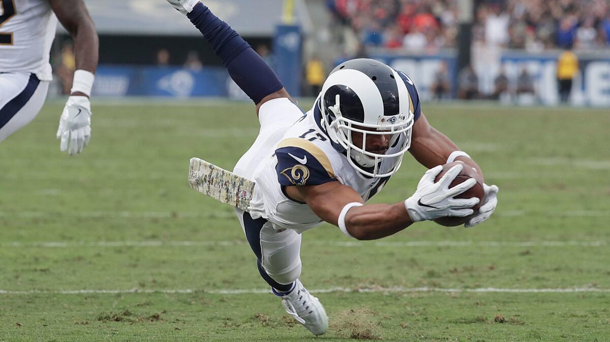 Rams receiver Robert Woods dives into the end zone for a third-quarter touchdown at the Coliseum on Nov 12.
