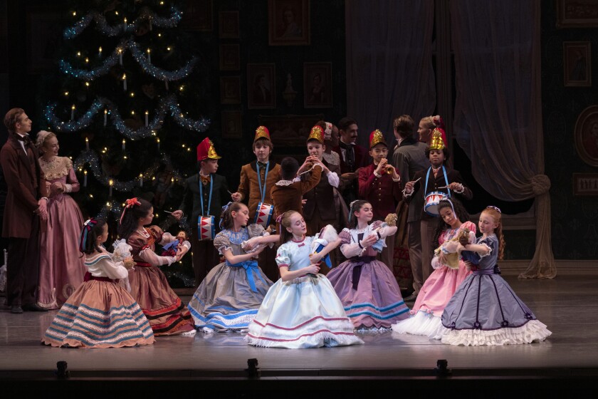 This image released by the New York City Ballet shows Athena Shevorykin, center, as Marie in "The Nutcracker," on Nov. 26, 2021, in New York. (Erin Baiano/New York City Ballet via AP)