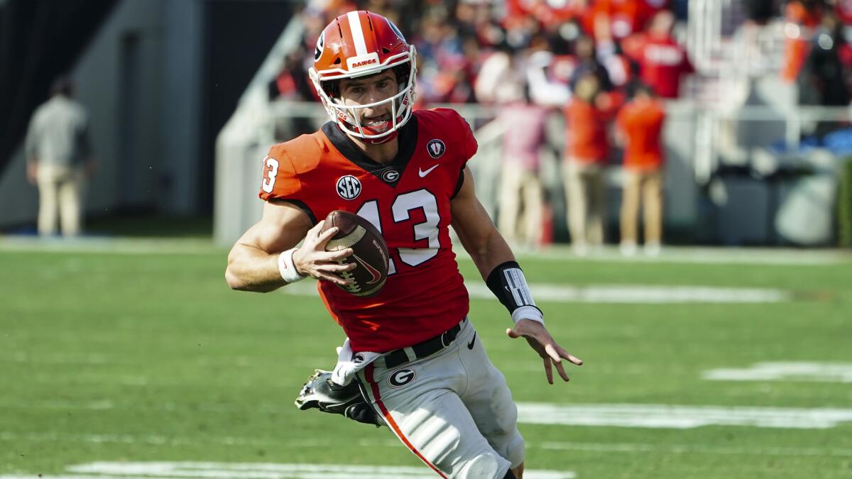 Georgia quarterback Stetson Bennett carries the ball against Georgia Tech on Nov. 26.