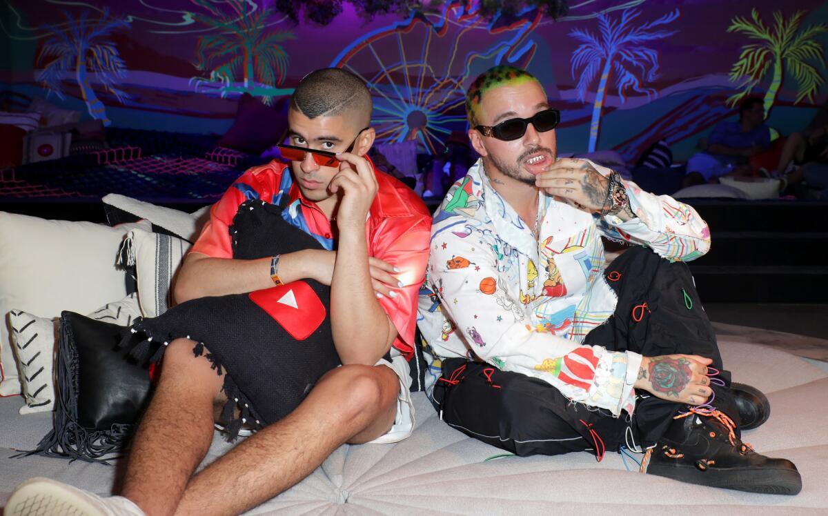 Bad Bunny, left, and J Balvin have released a joint album, "Oasis."