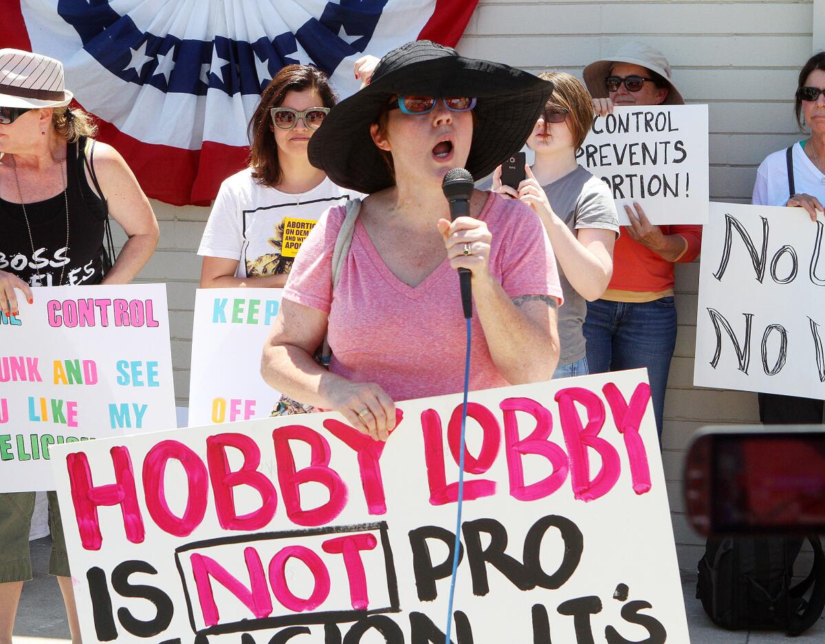 Beth Abaravich, of Glendale, takes the microphone to speak her mind at a protest, of mostly women, in front of the newly opened Hobby Lobby in Burbank on Monday, July 7, 2014. The protesters have taken issue with a lawsuit filed by Hobby Lobby for the right to strike some of the contraceptive options available through Obamacare that conflicts with the companies religious philosophy, a lawsuit that escalated to the Supreme Court of the United States who sided with Hobby Lobby.